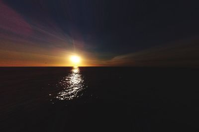 Scenic view of sea against sky at sunset