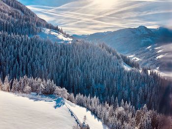 Scenic view of snow covered mountains against sky