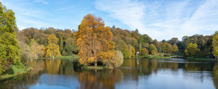 Scenic view of lake by trees during autumn