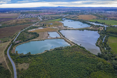 High angle view of river amidst landscape against sky