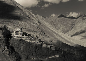 Panoramic view of people on mountain against sky