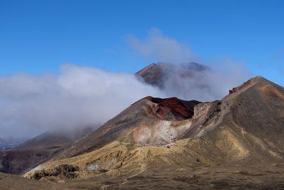 View of volcanic landscape against sky