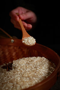 Close-up of person holding ice cream in bowl