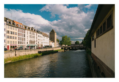 Canal amidst buildings in city