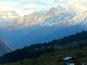 Scenic view of mountains against sky during winter