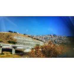 Scenic view of landscape against blue sky