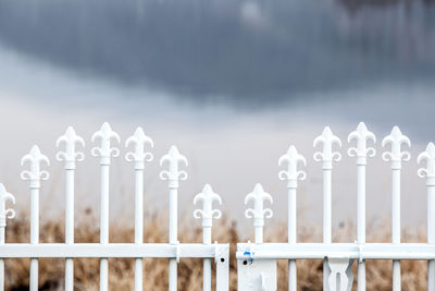 White gate against lake