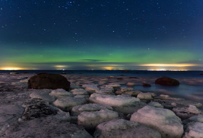 Scenic view of sea against sky at night