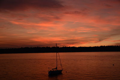 Silhouette of boat at sunset