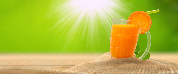 Close-up of orange juice on glass