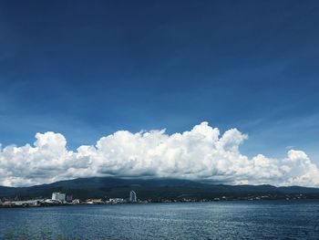 Scenic view of sea against blue sky