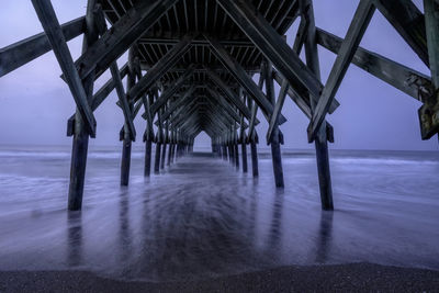 Pier over sea against sky