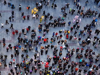 High angle view of people walking on city street