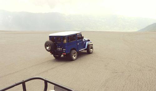 Train on mountain against sky