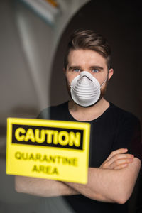 Portrait of young man holding text