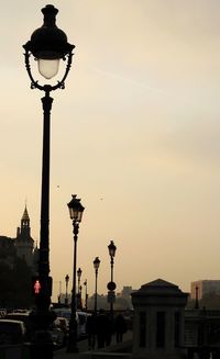 Low angle view of street light against building