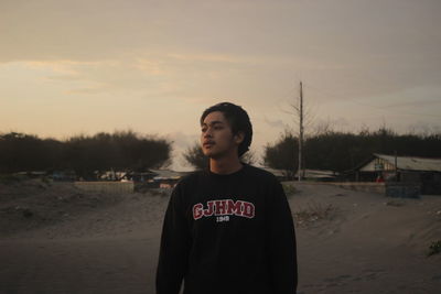 Portrait of teenage boy looking away