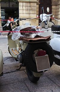 Motorcycle parked on street in city