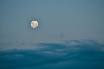 Low angle view of moon against sky at night