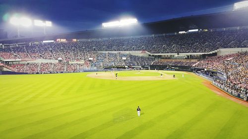 People playing soccer on field