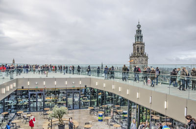 High angle view of people walking on bridge