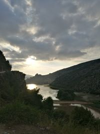 Scenic view of lake against sky during sunset