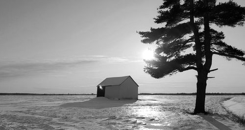 Lifeguard hut on beach against sky