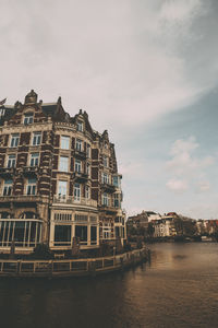 View of buildings against cloudy sky