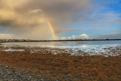 Scenic view of rainbow over sea