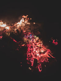 Low angle view of firework display at night