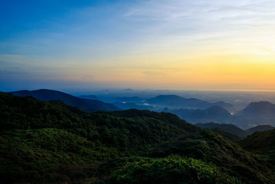 Scenic view of mountains against sky during sunset