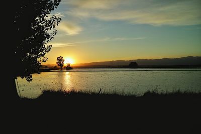 Scenic view of sunset over river