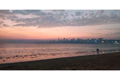 Scenic view of beach against sky during sunset