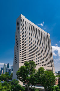 Low angle view of modern buildings against clear blue sky