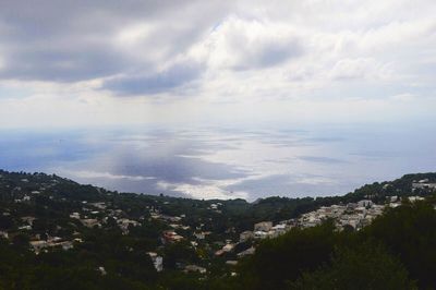 High angle view of calm sea against cloudy sky