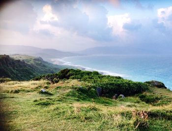Scenic view of sea against cloudy sky