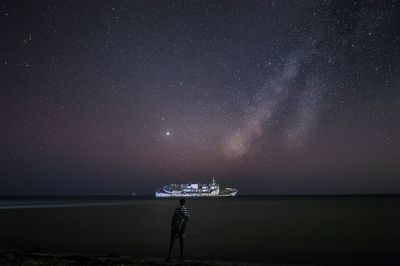 Scenic view of sea against sky at night