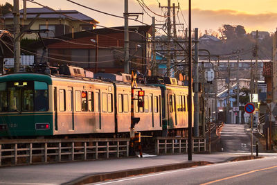 Train on railroad during sunrise