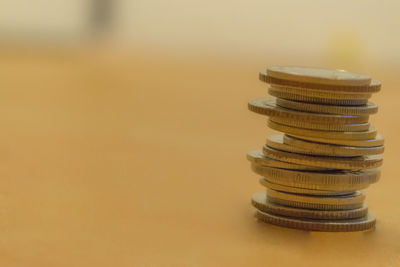 Close-up of coins on table