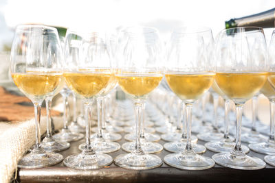 Wine being poured in wineglasses on table