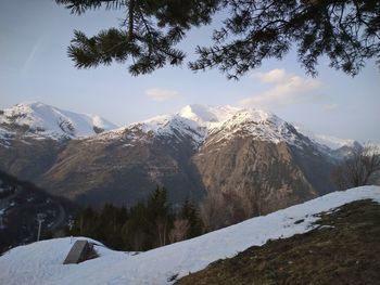 Scenic view of snowcapped mountains against sky