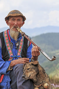 View of a man sitting against the sky