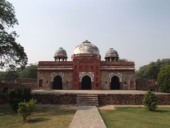 Facade of historical building against clear sky