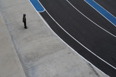 High angle view of man standing by race track