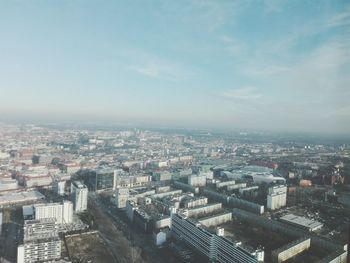 Aerial view of cityscape against sky