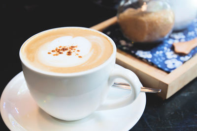 Close-up of cappuccino on table