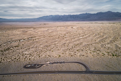 Mesquite flat sand dunes in death valley with parking area in foreground
