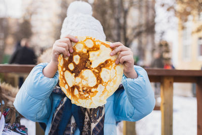 Midsection of man holding ice cream