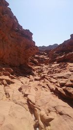 Rock formations in desert against clear sky