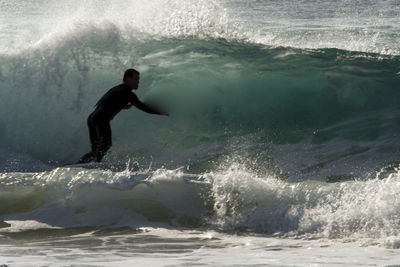 People surfing in sea